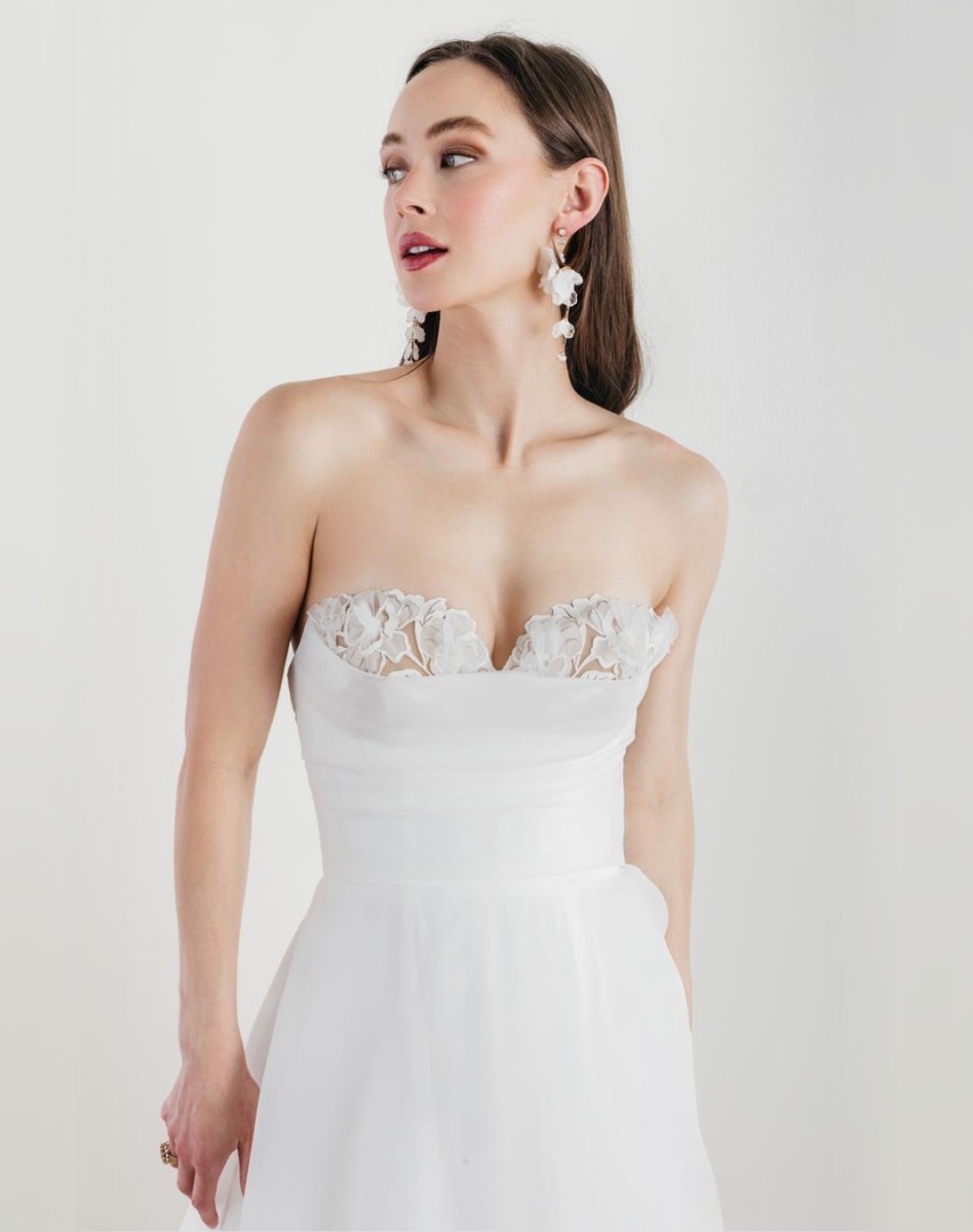 Photo of the model wearing a white bridal gown